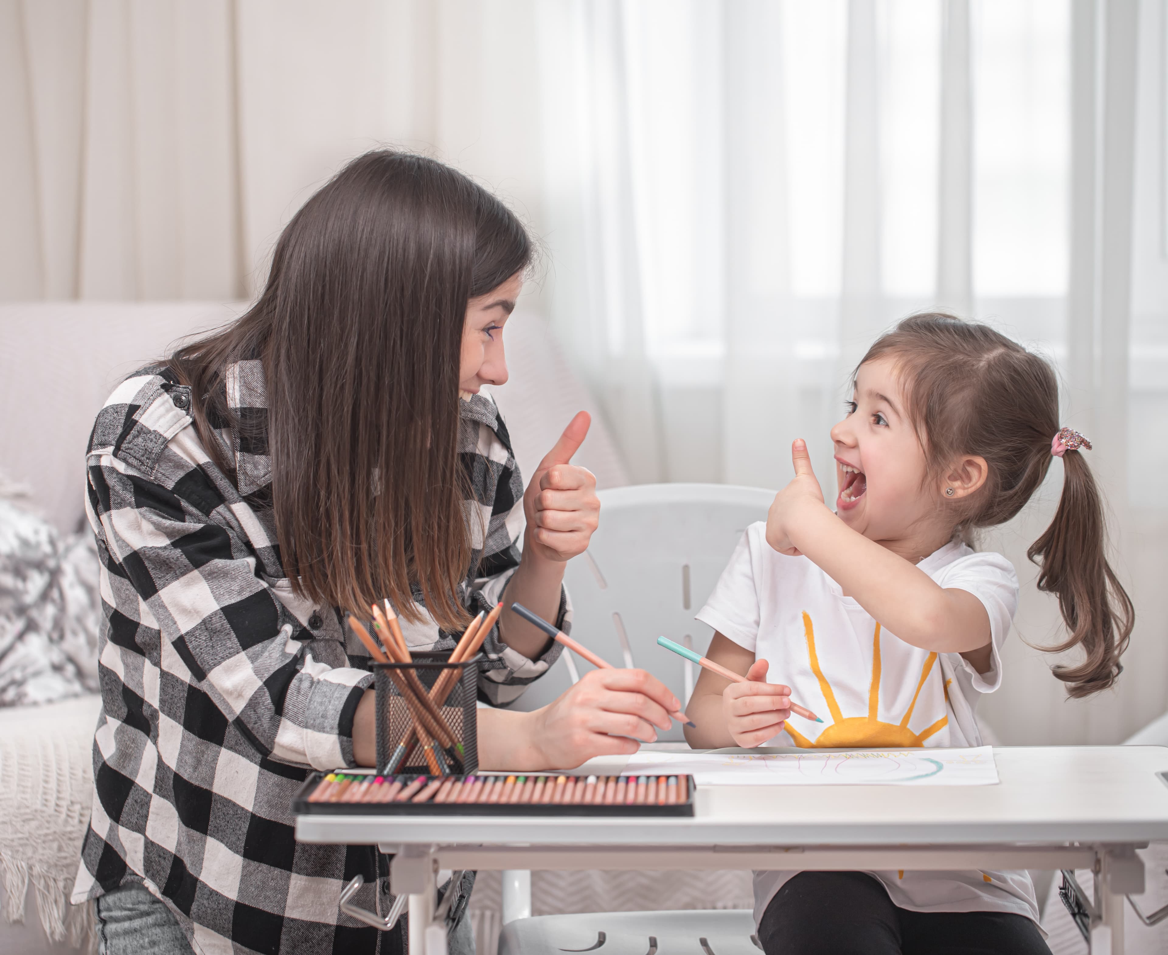 Therapist and child in a positive learning session